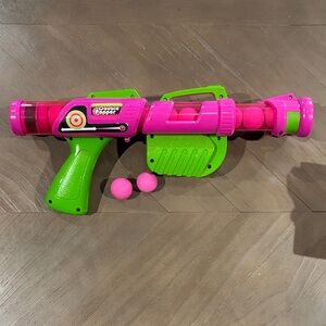 Vibrant Pink and Green Foam Ball Blaster
